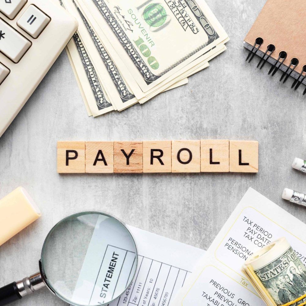 top-view-payroll-concept-with-items_11zon-scaled